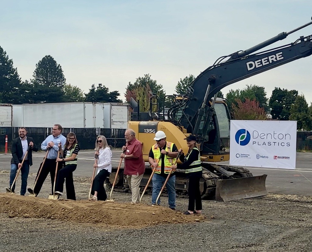 Denton Plastics staff, and interest holders hold shovels as they break ground on the facility expansion. 
